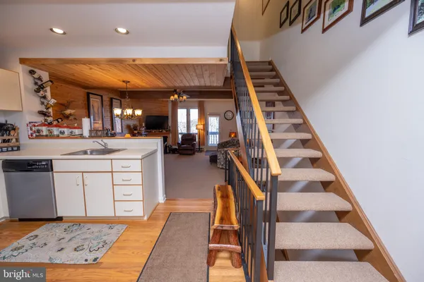 a kitchen with white cabinets and appliances