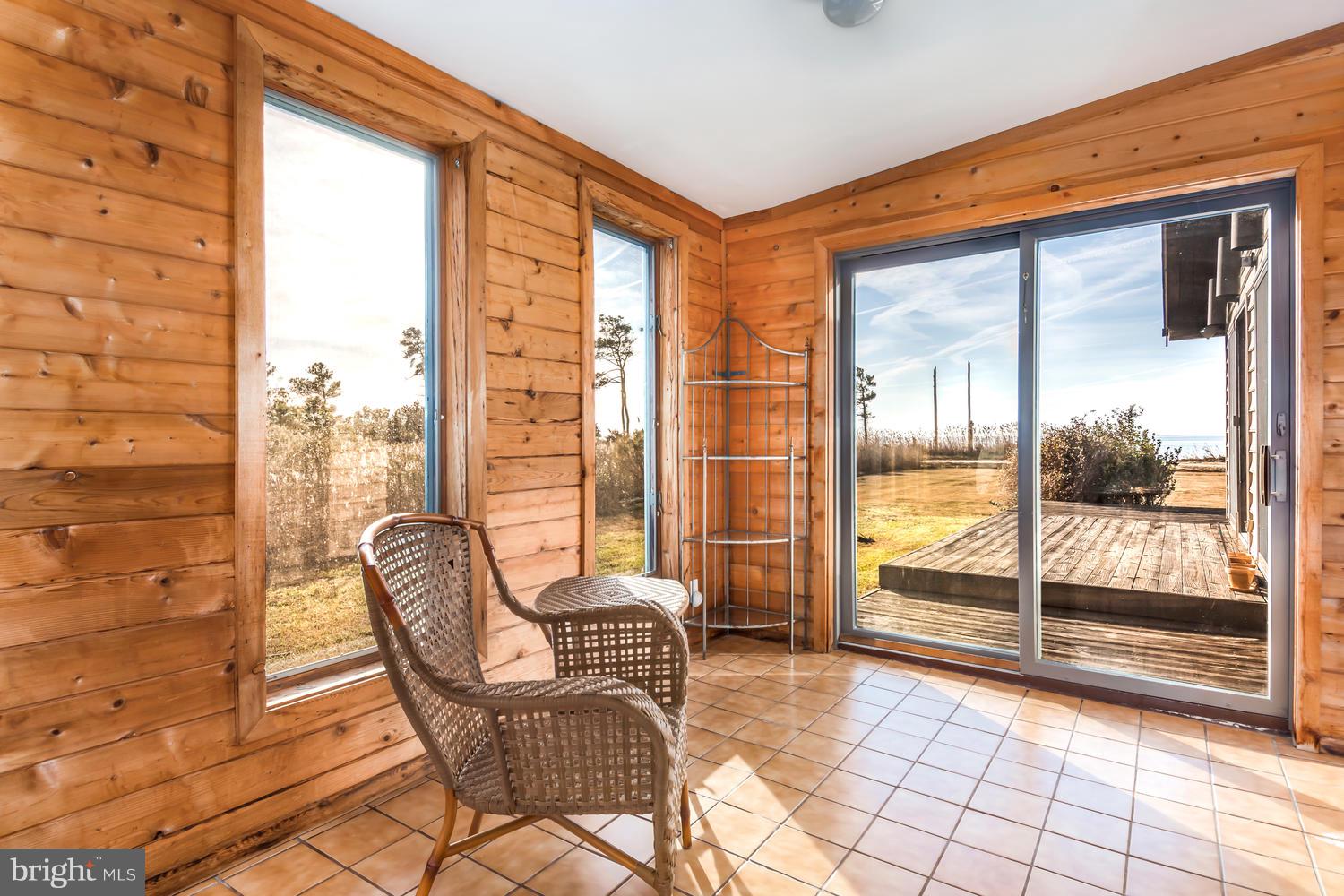 5239 Ragged Point Road Cambridge, MD 21613 - Photo 15 of 36 Sunroom with wateviews & deck