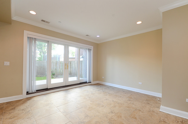 245 North Northwest Highway Park Ridge, IL 60068 - Photo 12 of 15 a view of an empty room with wooden floor and a window