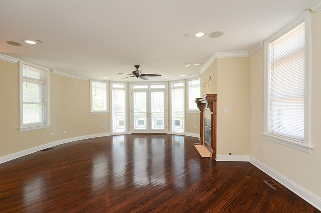 245 North Northwest Highway Park Ridge, IL 60068 - Photo 3 of 15 a view of an empty room with wooden floor and a window