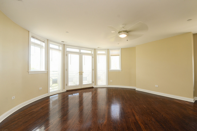 245 North Northwest Highway Park Ridge, IL 60068 - Photo 5 of 15 a view of an empty room with wooden floor and a window