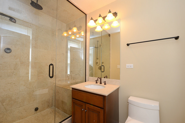 245 North Northwest Highway Park Ridge, IL 60068 - Photo 8 of 15 a bathroom with a sink a toilet and shower