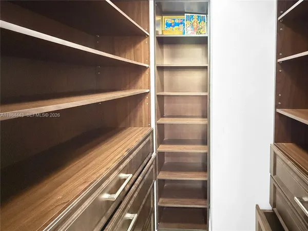 a bathroom with a granite countertop sink a toilet and a mirror
