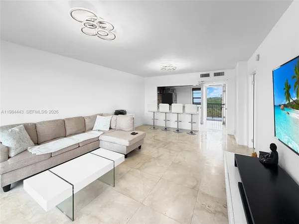 a living room with furniture and a table