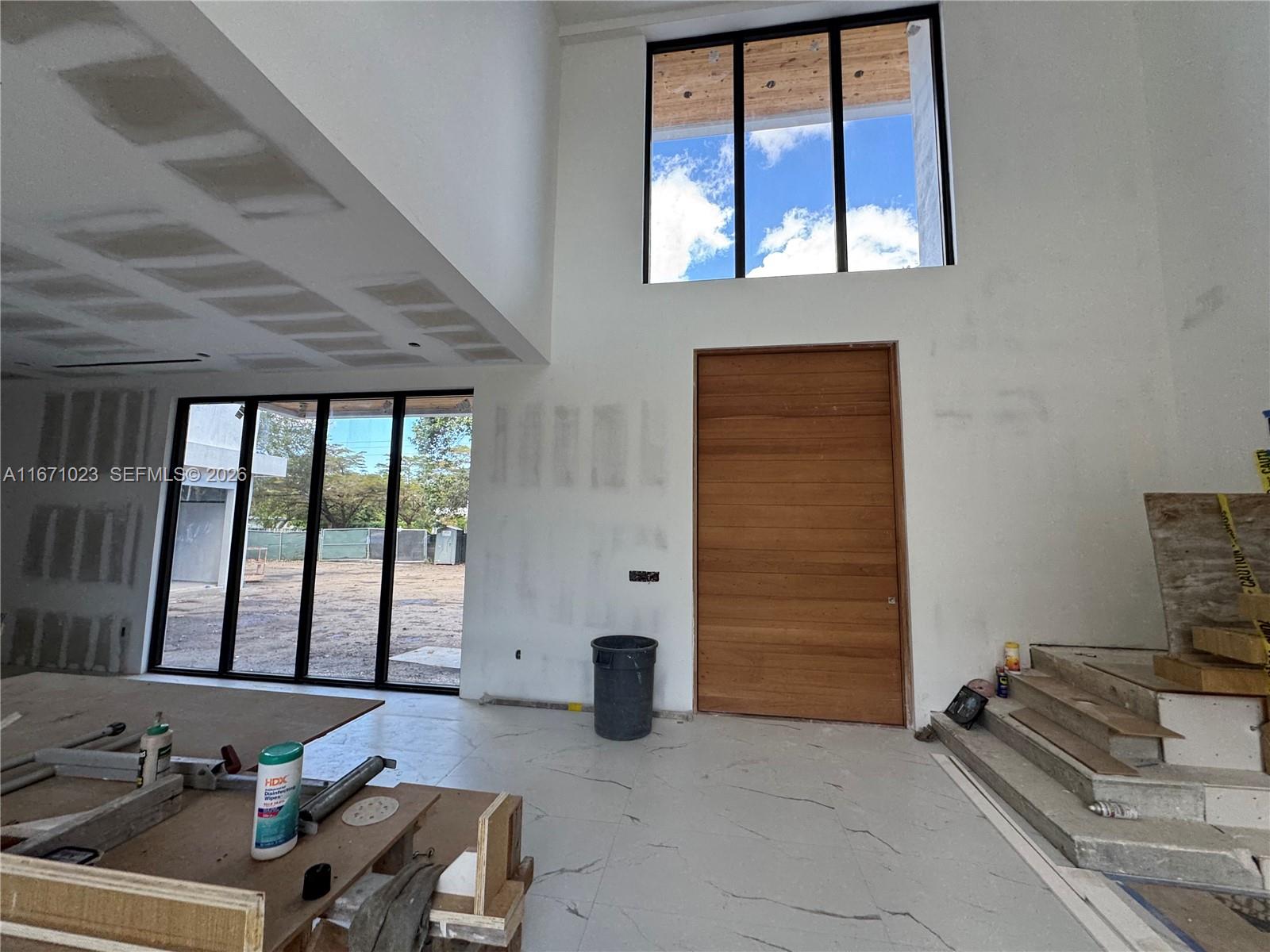 6666 Southwest 96th Street Pinecrest, FL 33156 - Photo 13 of 82 a living room with furniture and large windows