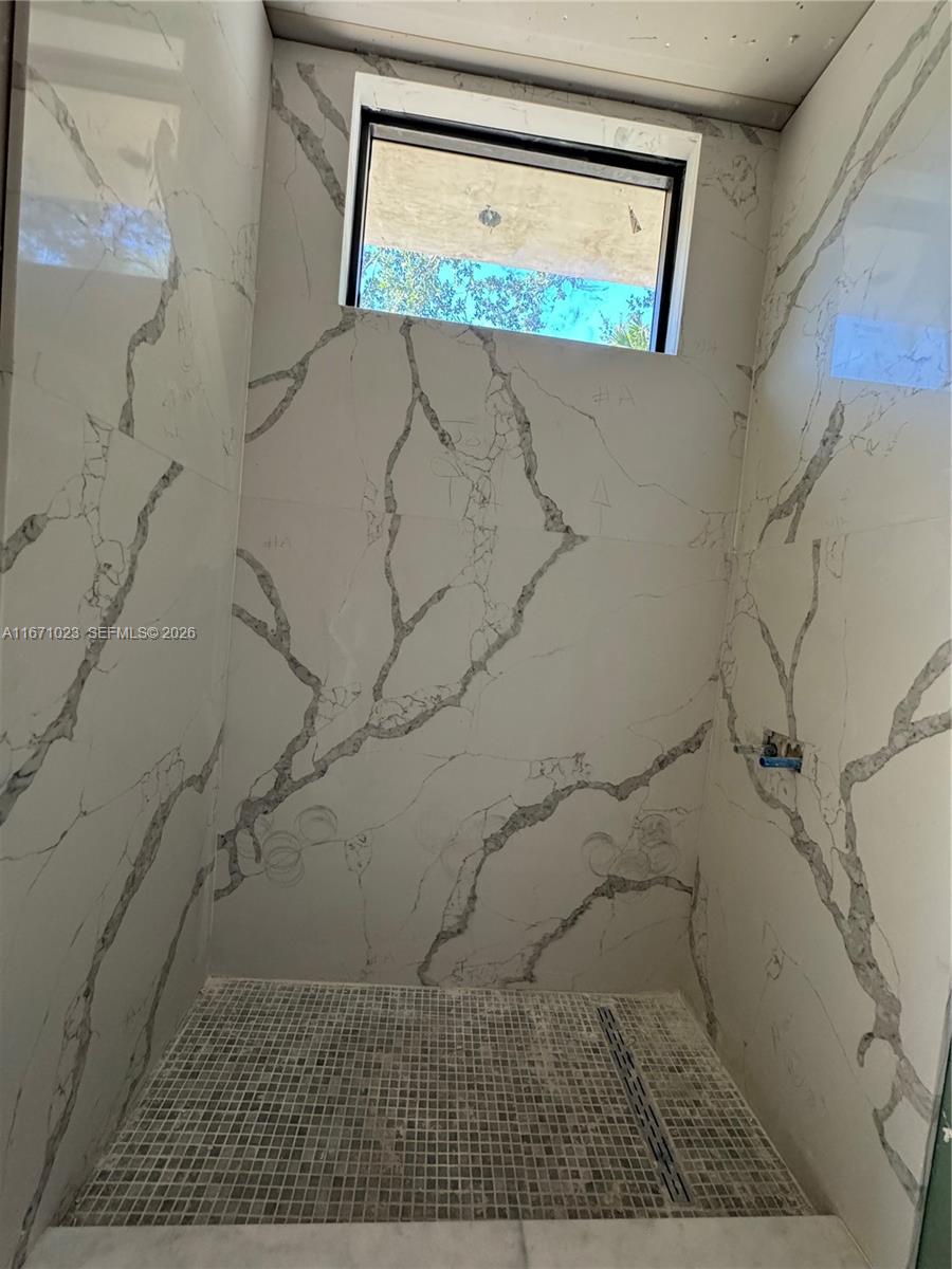 6666 Southwest 96th Street Pinecrest, FL 33156 - Photo 15 of 82 a picture of a bathroom with a shower