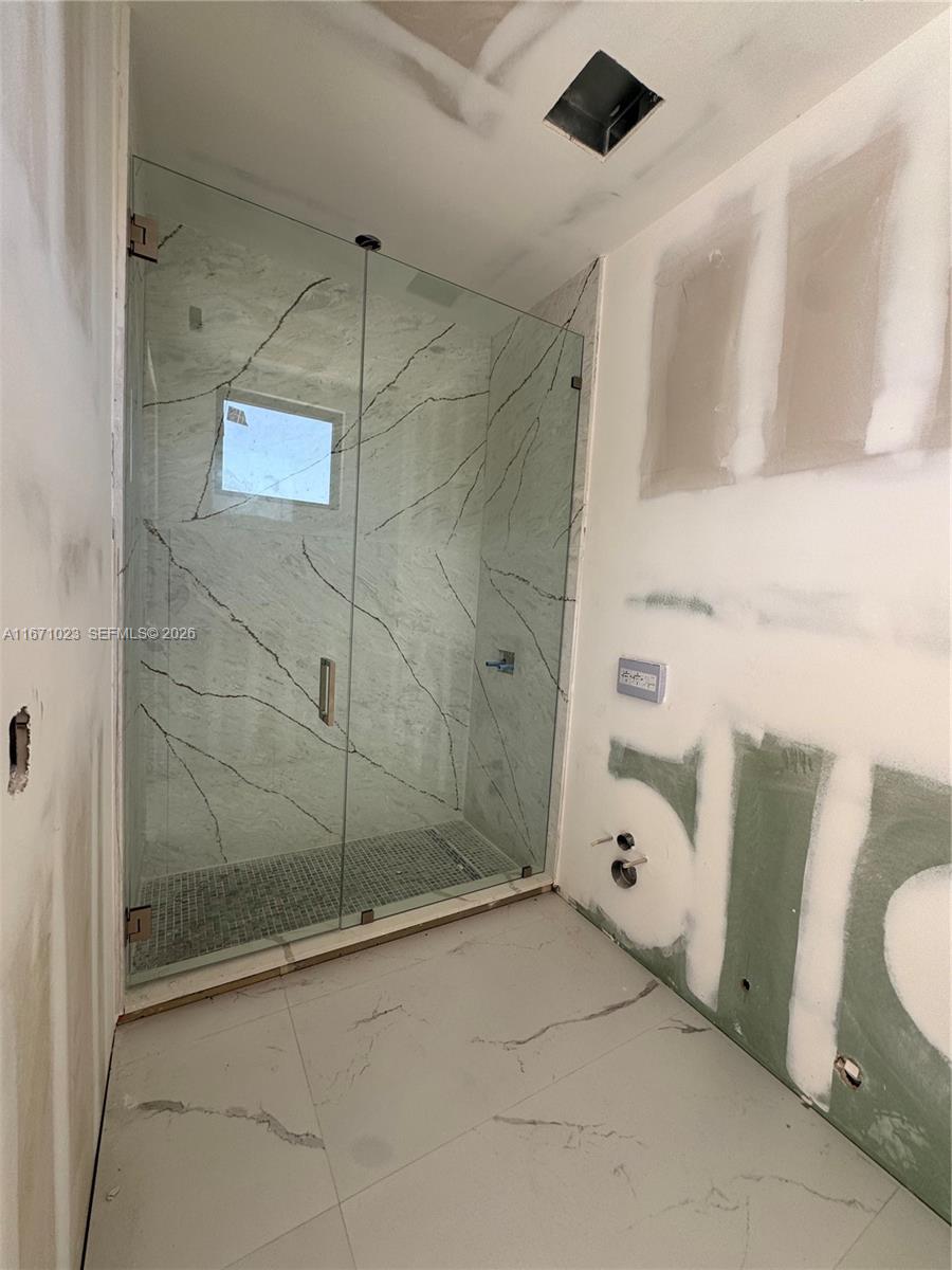 6666 Southwest 96th Street Pinecrest, FL 33156 - Photo 22 of 82 a bathroom with a bathtub and shower