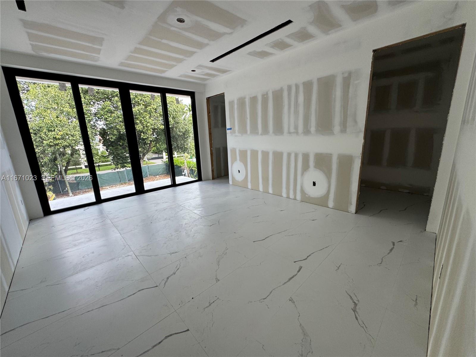 6666 Southwest 96th Street Pinecrest, FL 33156 - Photo 24 of 82 a view of an empty room with a window