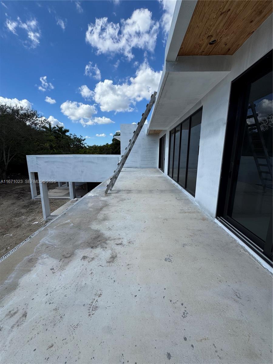 6666 Southwest 96th Street Pinecrest, FL 33156 - Photo 31 of 82 a view of outdoor space with deck and kitchen