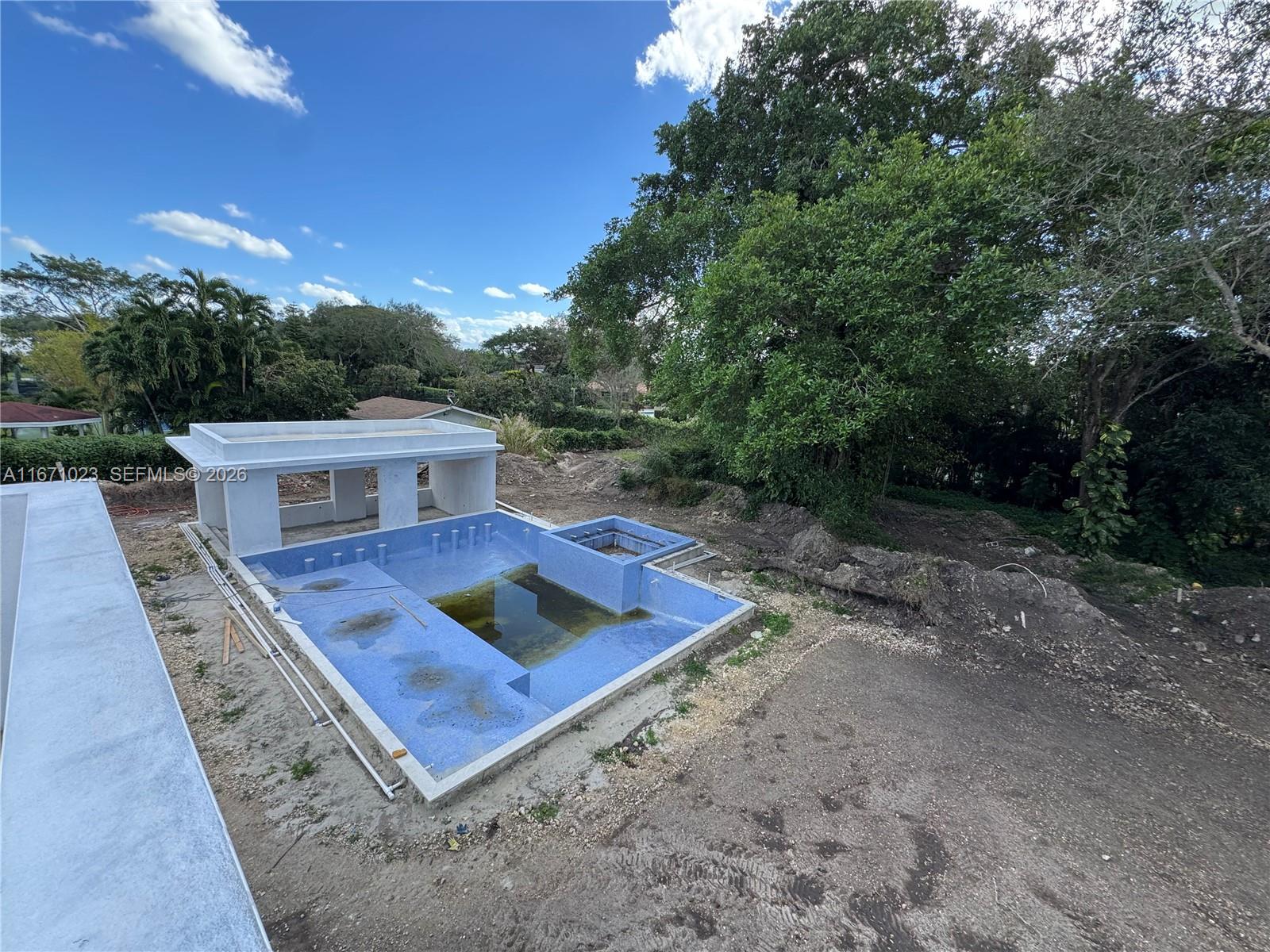 6666 Southwest 96th Street Pinecrest, FL 33156 - Photo 37 of 82 a view of a house with a yard
