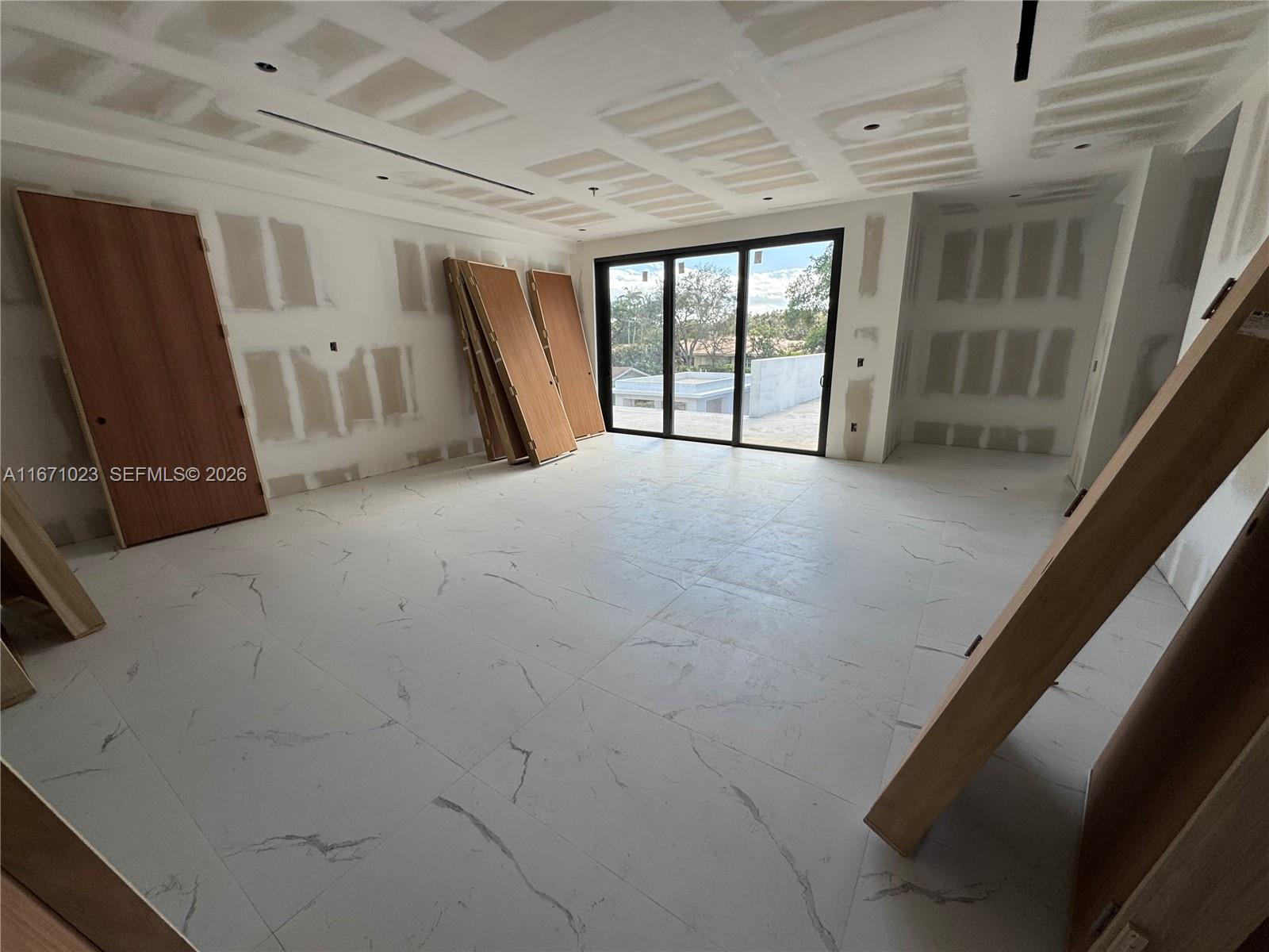 6666 Southwest 96th Street Pinecrest, FL 33156 - Photo 44 of 82 a view of an empty room with a fireplace
