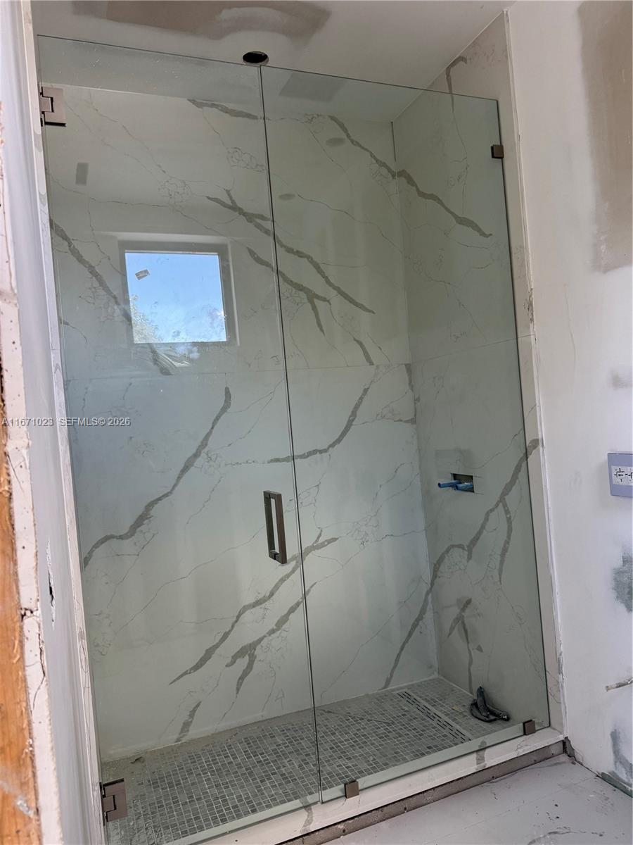 6666 Southwest 96th Street Pinecrest, FL 33156 - Photo 46 of 82 a bathroom with a shower