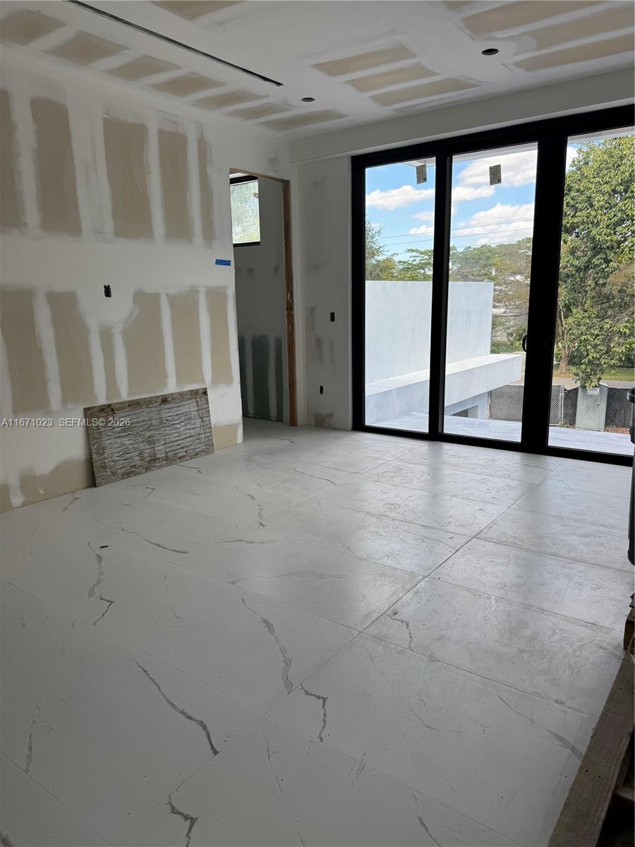 6666 Southwest 96th Street Pinecrest, FL 33156 - Photo 47 of 82 a view of an empty room with a window