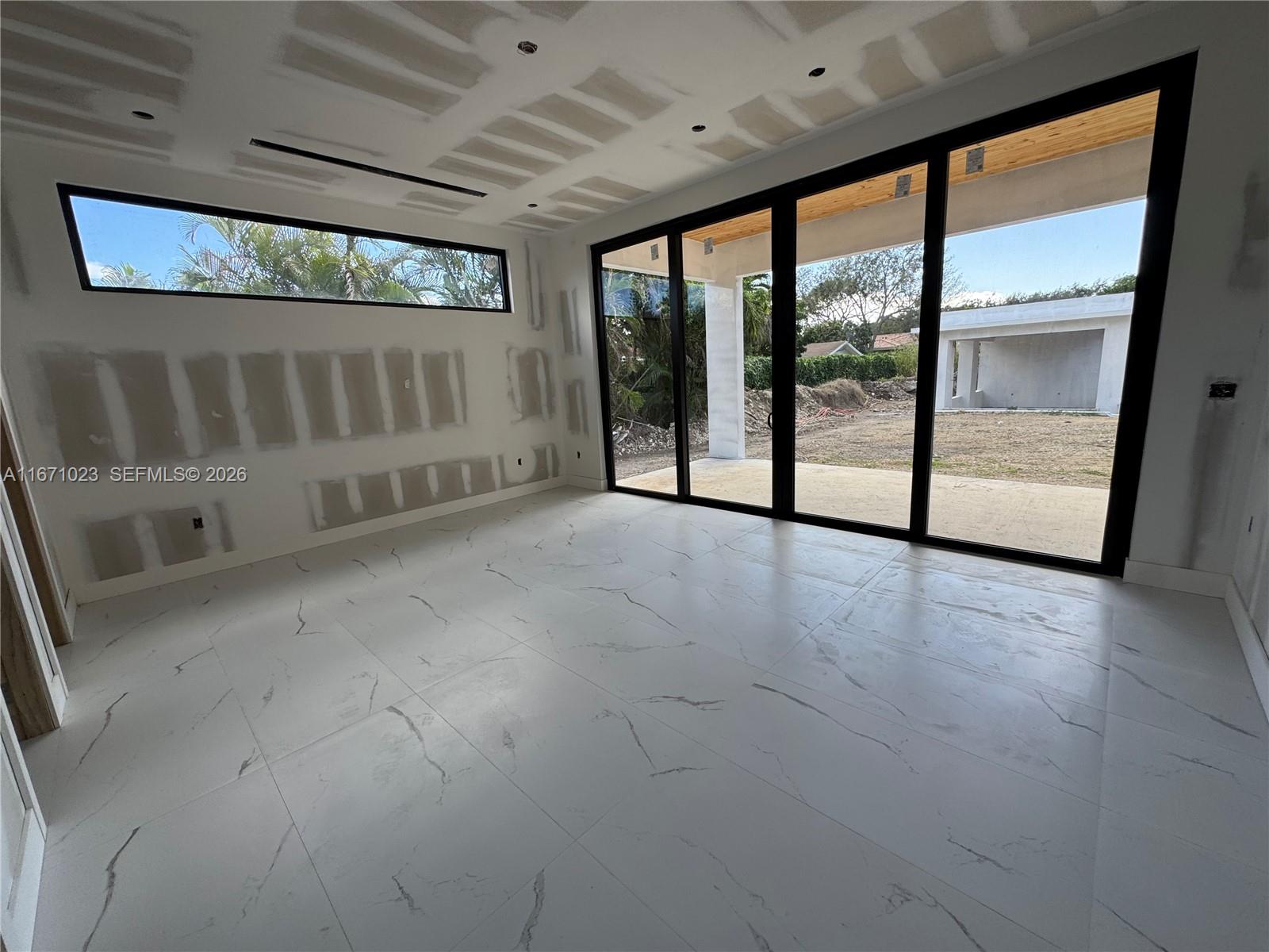 6666 Southwest 96th Street Pinecrest, FL 33156 - Photo 48 of 82 a view of an empty room with a window