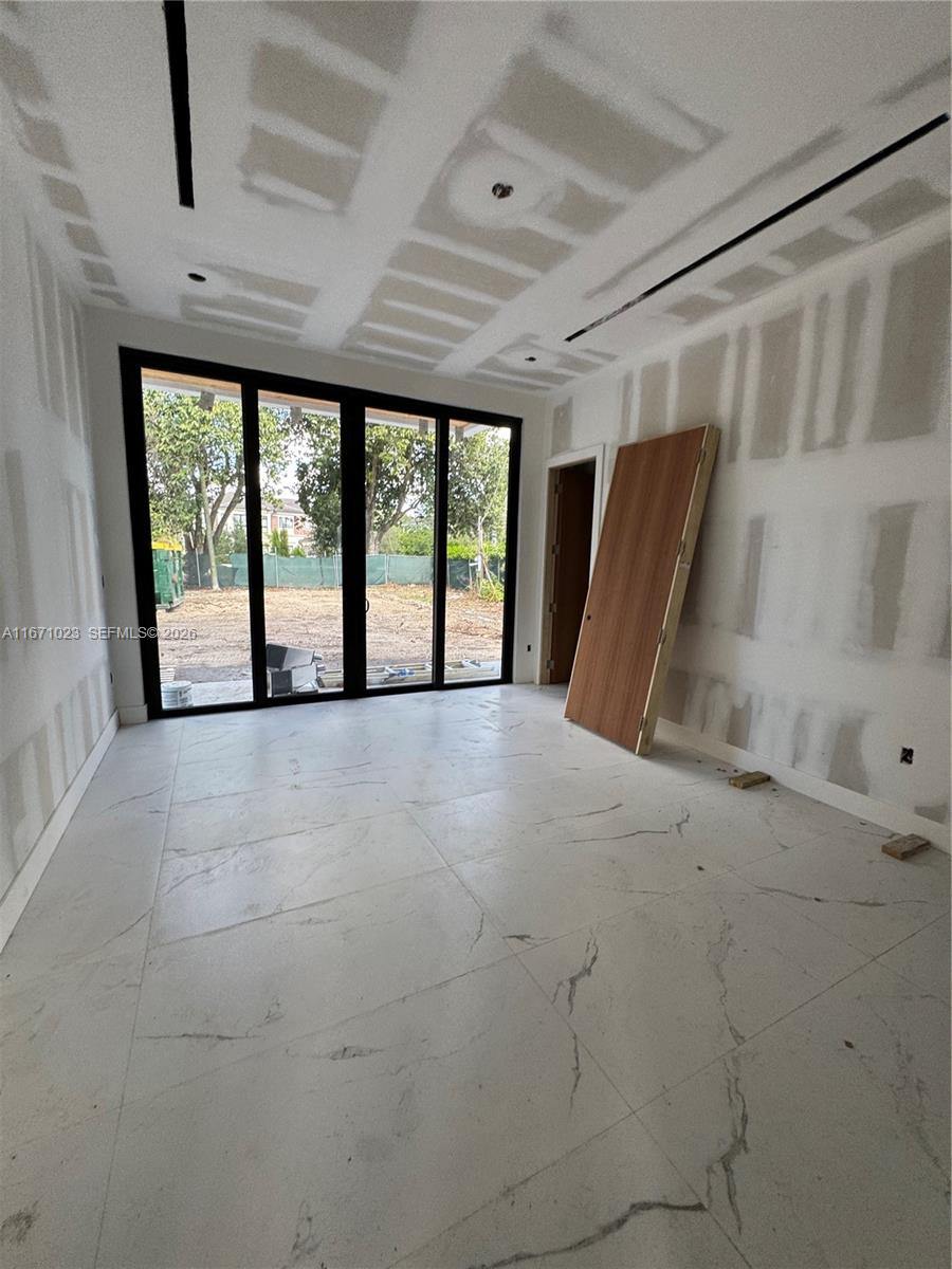 6666 Southwest 96th Street Pinecrest, FL 33156 - Photo 56 of 82 a view of an empty room with a balcony