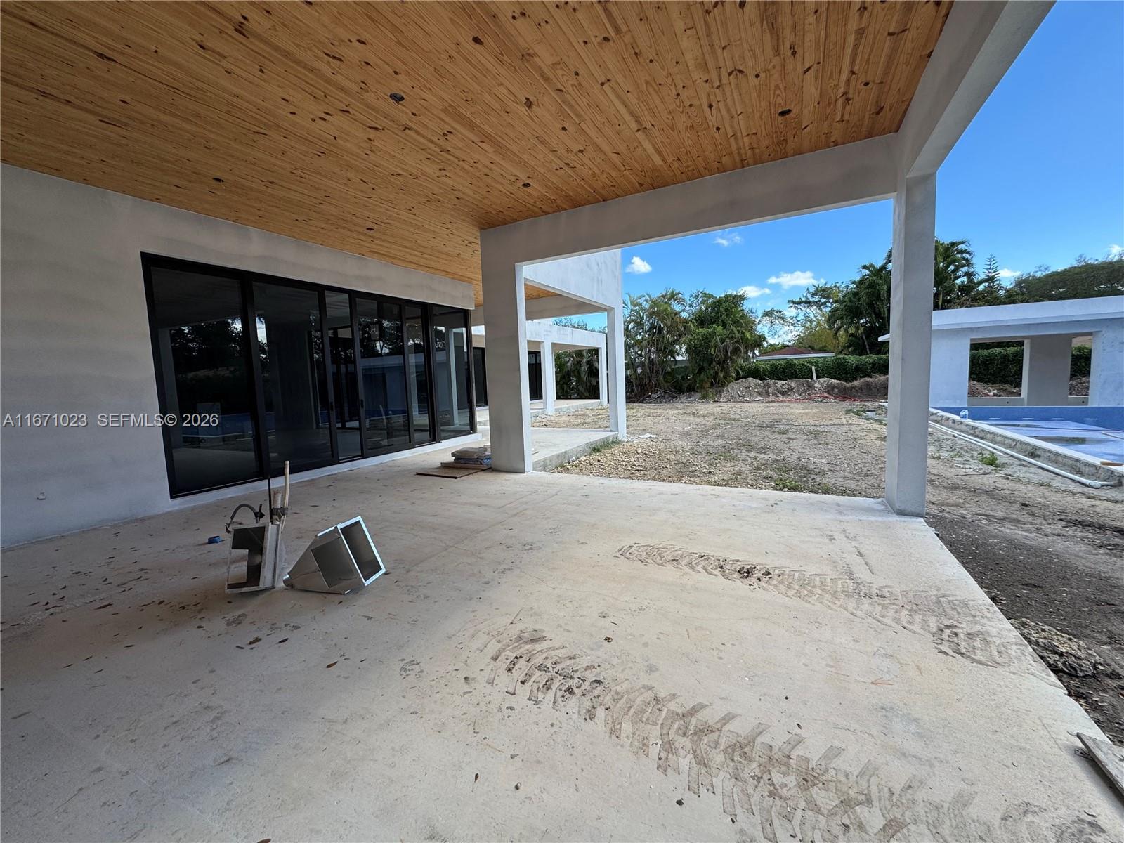 6666 Southwest 96th Street Pinecrest, FL 33156 - Photo 60 of 82 a view of a lounge chair in front of house