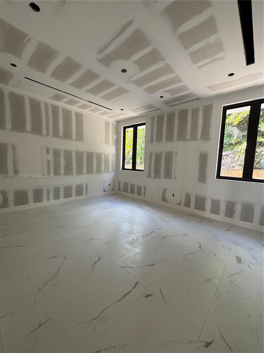 6666 Southwest 96th Street Pinecrest, FL 33156 - Photo 69 of 82 an empty room with windows