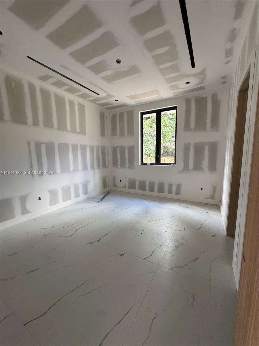 6666 Southwest 96th Street Pinecrest, FL 33156 - Photo 72 of 82 a view of an empty room with a window