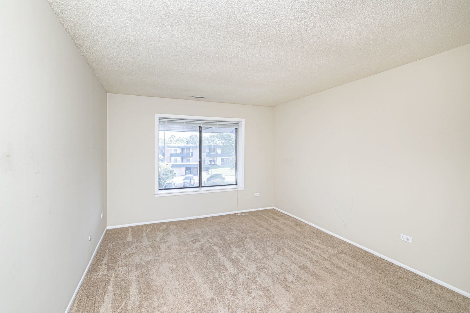 1255 North Sterling Avenue, Unit 201 Palatine, IL 60067 - Photo 15 of 22 an empty room with a window