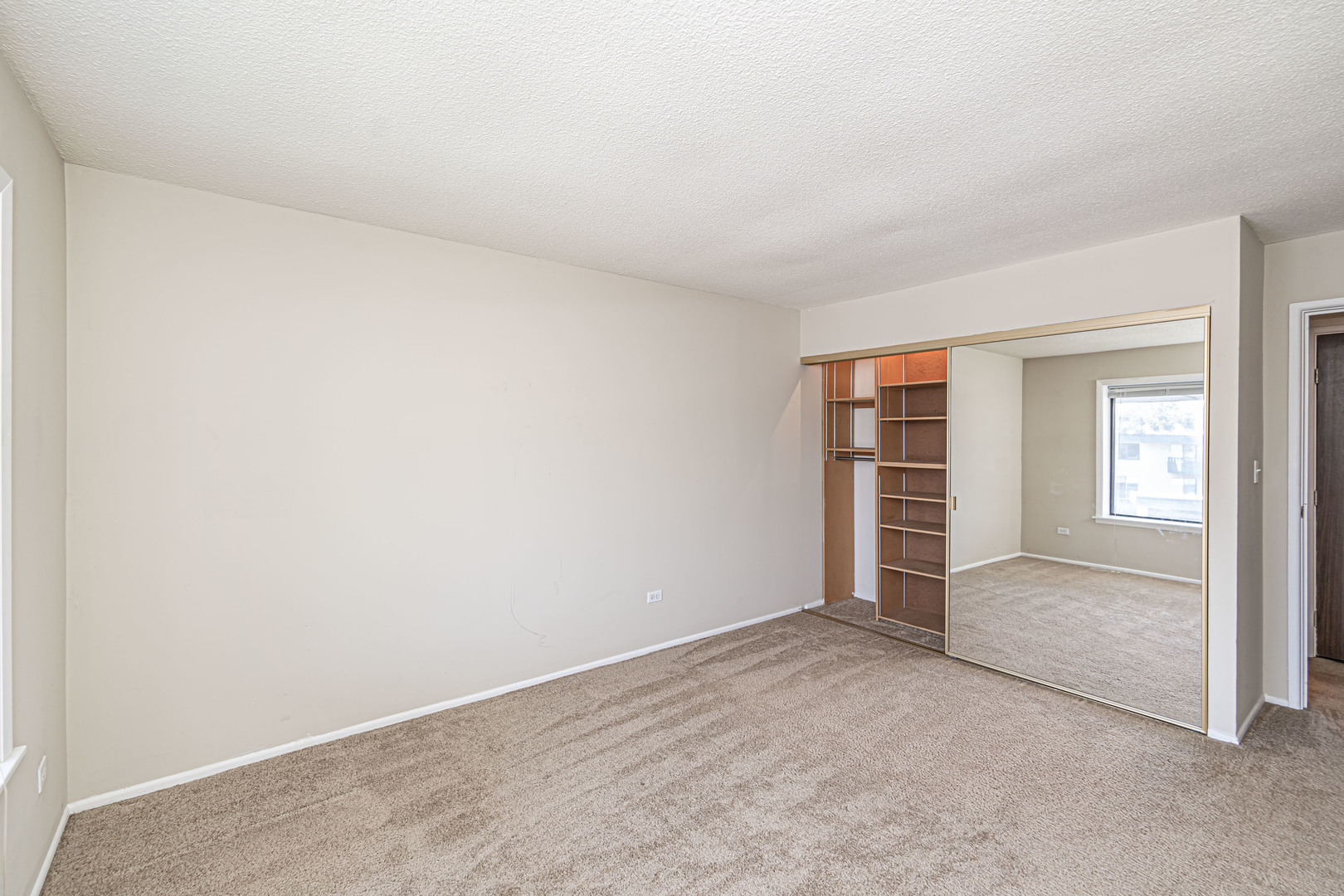 1255 North Sterling Avenue, Unit 201 Palatine, IL 60067 - Photo 16 of 22 an empty room with windows