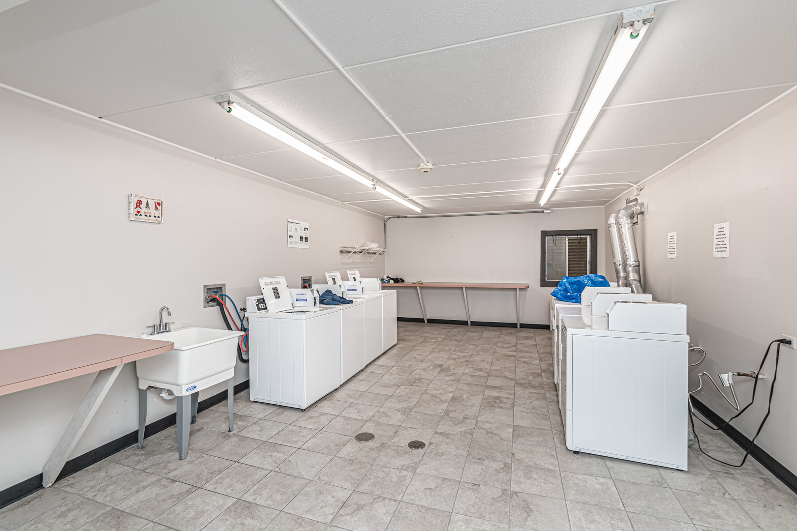 1255 North Sterling Avenue, Unit 201 Palatine, IL 60067 - Photo 18 of 22 a room with a couch and a table