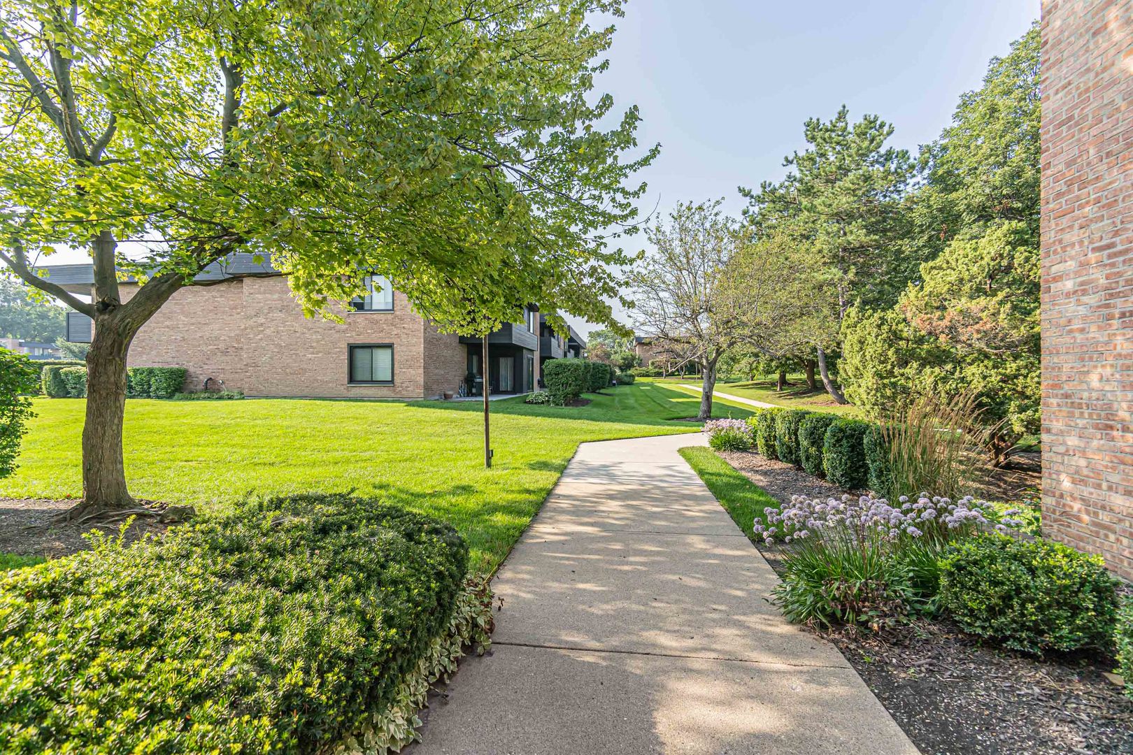 1255 North Sterling Avenue, Unit 201 Palatine, IL 60067 - Photo 21 of 22 a view of a backyard with a garden