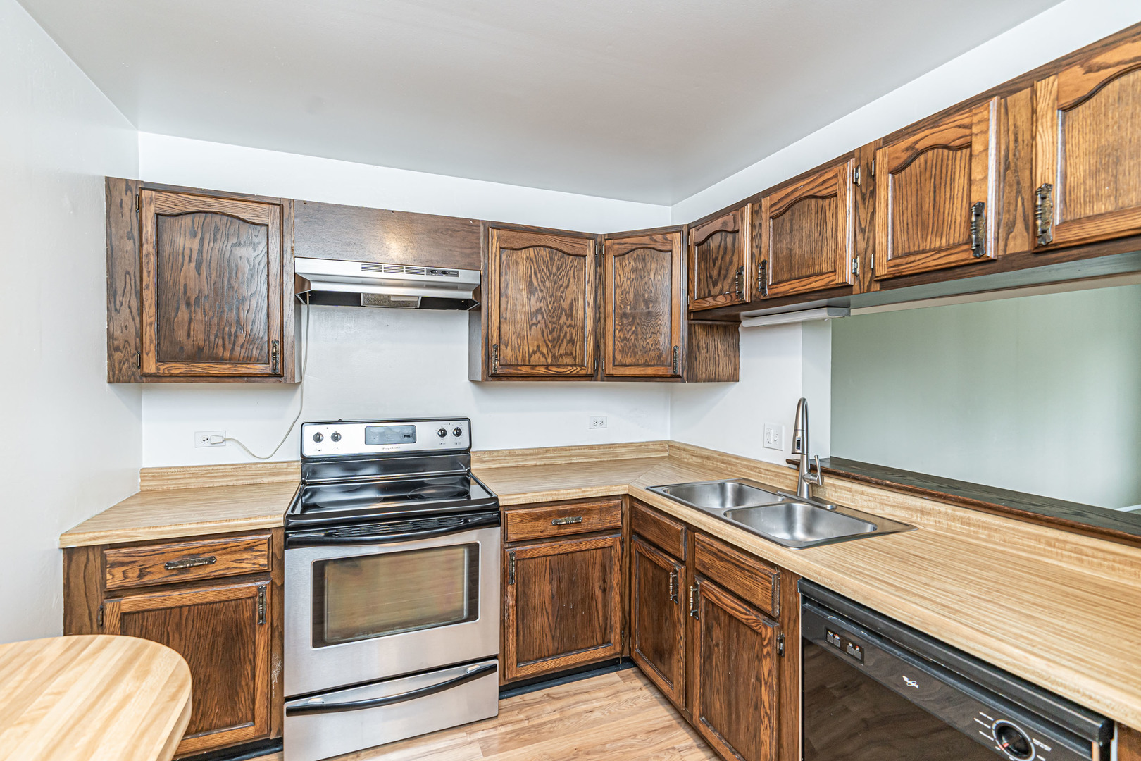 1255 North Sterling Avenue, Unit 201 Palatine, IL 60067 - Photo 5 of 22 a kitchen with cabinets appliances and a sink