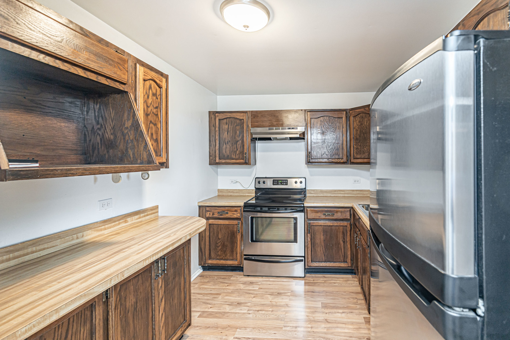 1255 North Sterling Avenue, Unit 201 Palatine, IL 60067 - Photo 6 of 22 a kitchen with granite countertop a sink stove and refrigerator