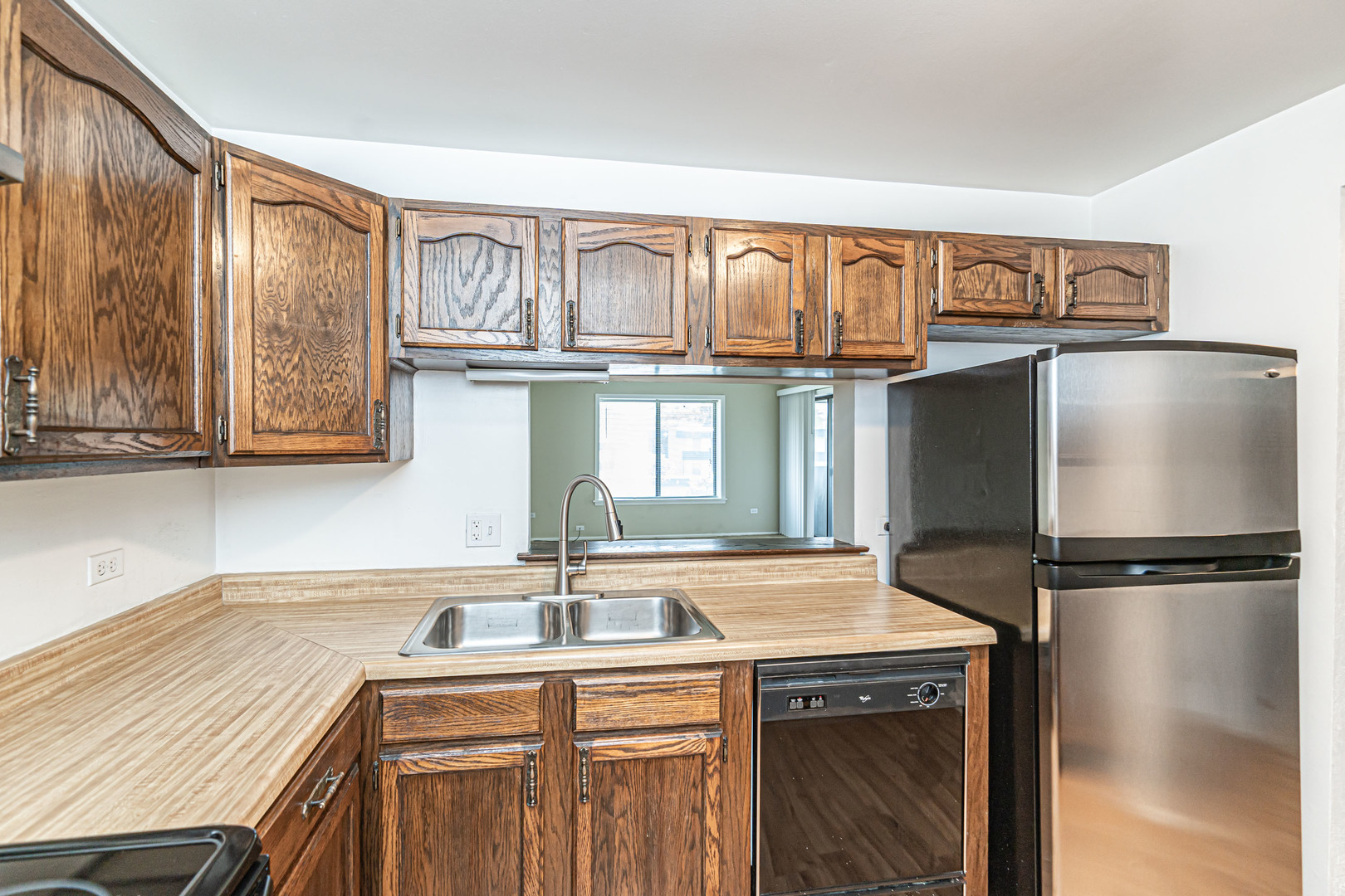1255 North Sterling Avenue, Unit 201 Palatine, IL 60067 - Photo 8 of 22 a kitchen with a refrigerator and a sink