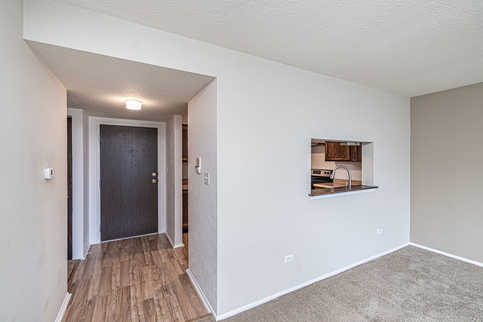 1255 North Sterling Avenue, Unit 201 Palatine, IL 60067 - Photo 9 of 22 a view of a hallway with wooden floor