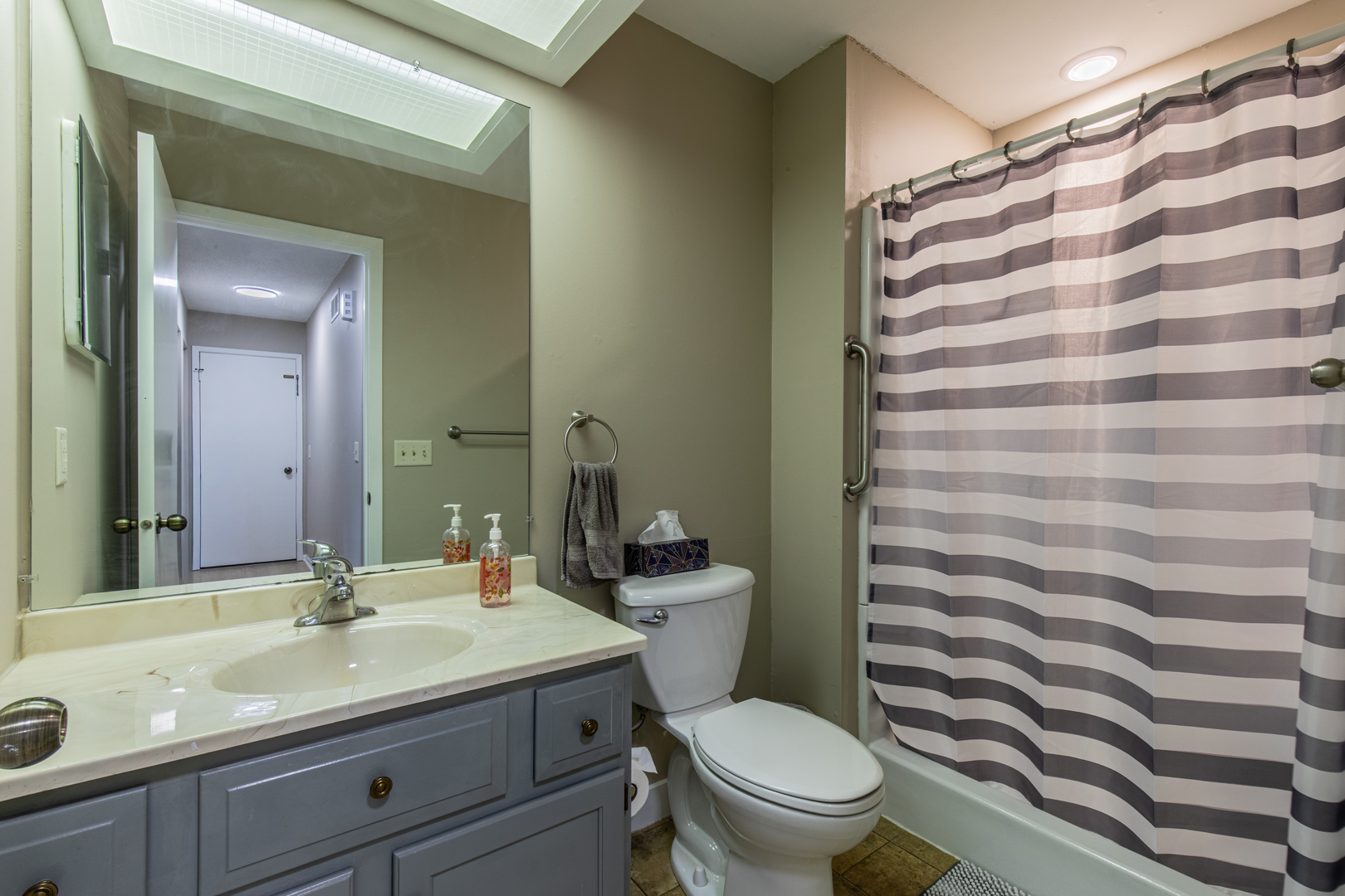 973 Innsbruck Lane, Unit 4G Princeton, IL 61356 - Photo 15 of 15 a bathroom with a granite countertop bathtub sink vanity mirror and toilet