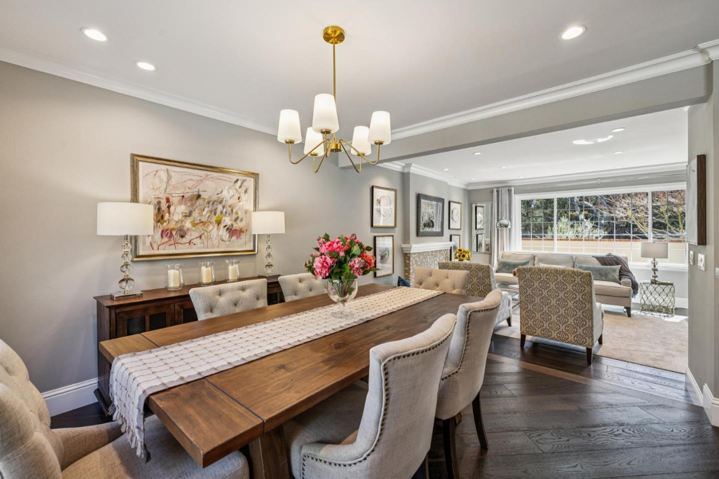 21685 Regnart Road Cupertino, CA 95014 - Photo 12 of 68 a dining room with wooden floor a chandelier a wooden table and chairs