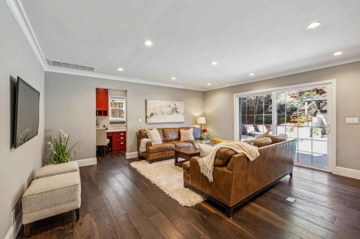 21685 Regnart Road Cupertino, CA 95014 - Photo 21 of 68 a living room with furniture or couch and a flat screen tv