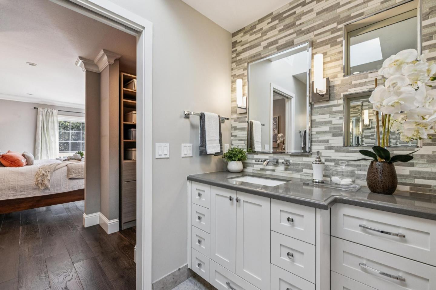 21685 Regnart Road Cupertino, CA 95014 - Photo 38 of 68 a spacious en suite bathroom with double sink and a mirror