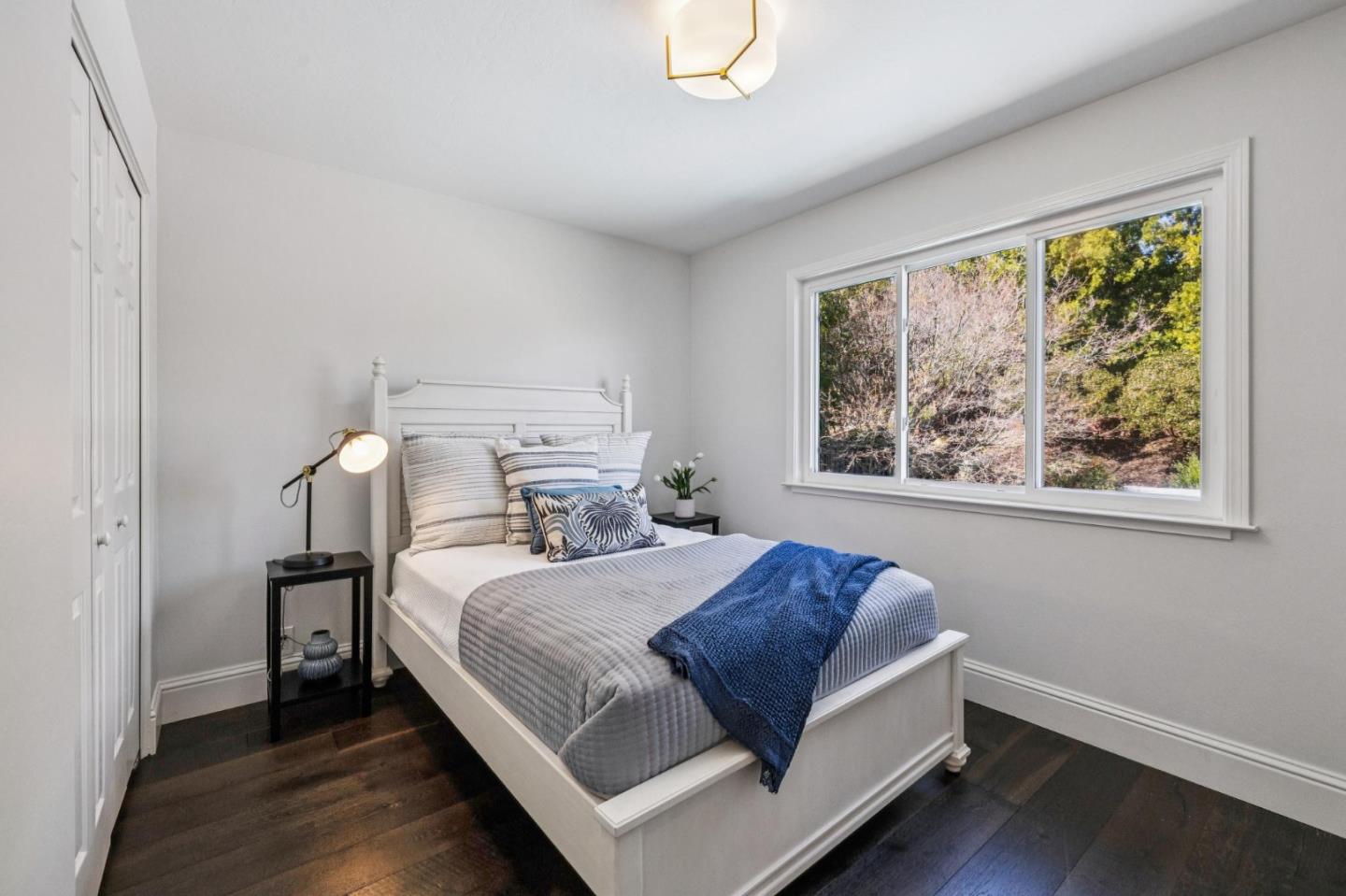 21685 Regnart Road Cupertino, CA 95014 - Photo 42 of 68 a bedroom with a bed and a window