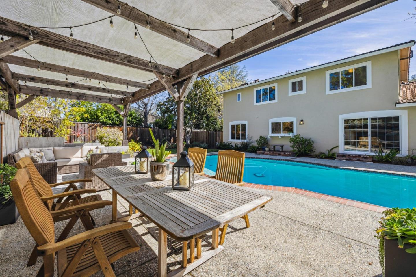 21685 Regnart Road Cupertino, CA 95014 - Photo 54 of 68 a view of a patio with a table chairs and a backyard