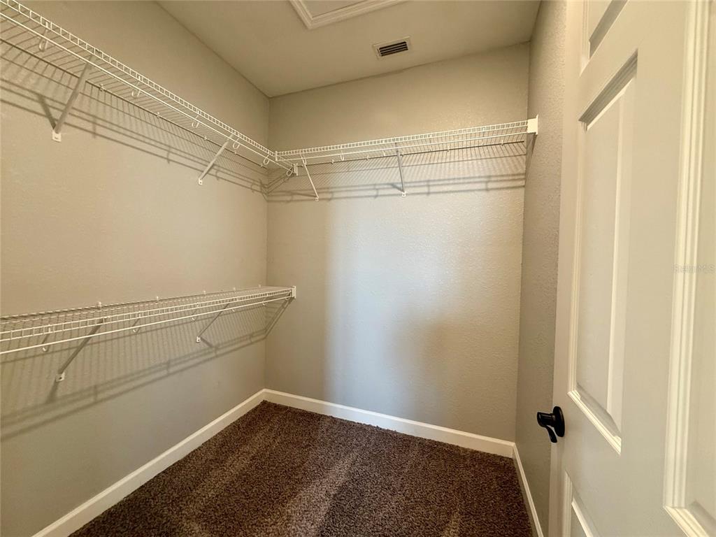2541 Pine Place Winter Haven, FL 33881 - Photo 17 of 34 a view of a room with racks on the wall