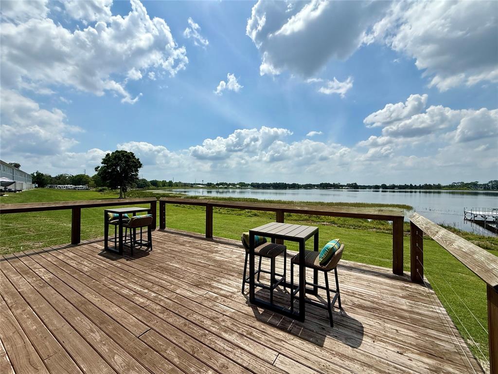 2541 Pine Place Winter Haven, FL 33881 - Photo 25 of 34 a view of a terrace with wooden floor and lake view