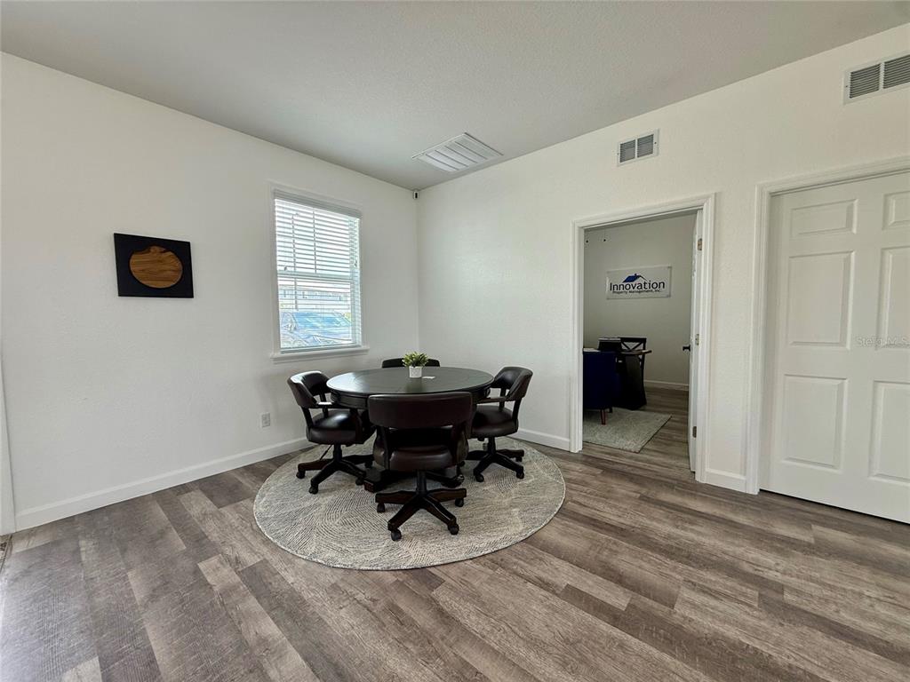 2541 Pine Place Winter Haven, FL 33881 - Photo 32 of 34 a view of a dining room with furniture and a window