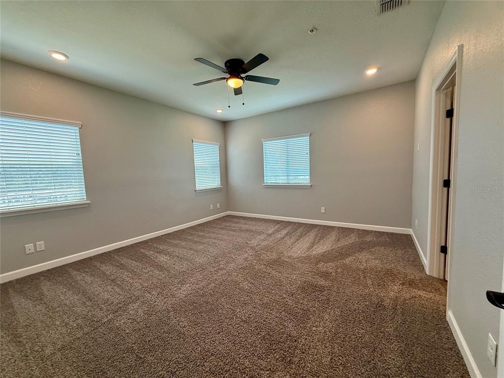 2541 Pine Place Winter Haven, FL 33881 - Photo 9 of 34 a view of an empty room with a window