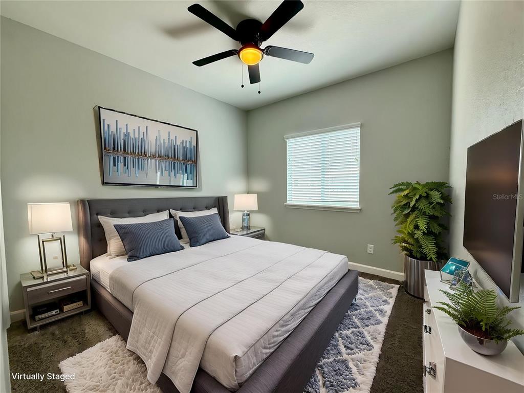 2541 Pine Place Winter Haven, FL 33881 - Photo 10 of 34 a bedroom with bed and a chandelier