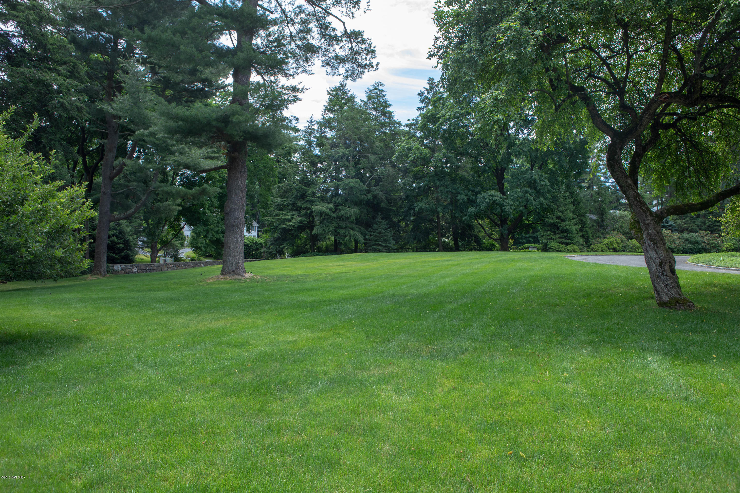70 Midwood Road Greenwich, CT 06830 - Photo 23 of 26 a view of a trees with a yard