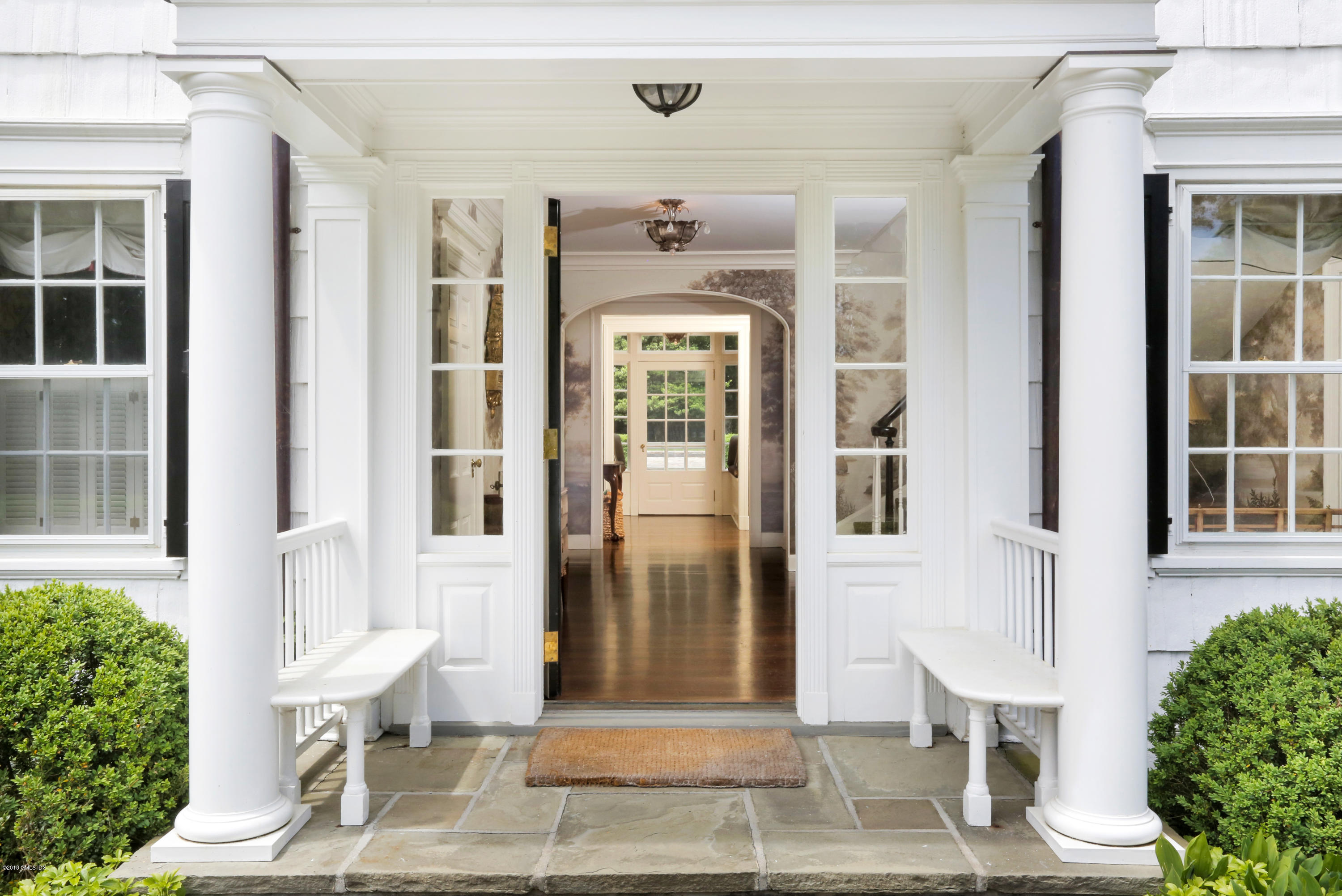 70 Midwood Road Greenwich, CT 06830 - Photo 3 of 26 a front view of a house with a glass door