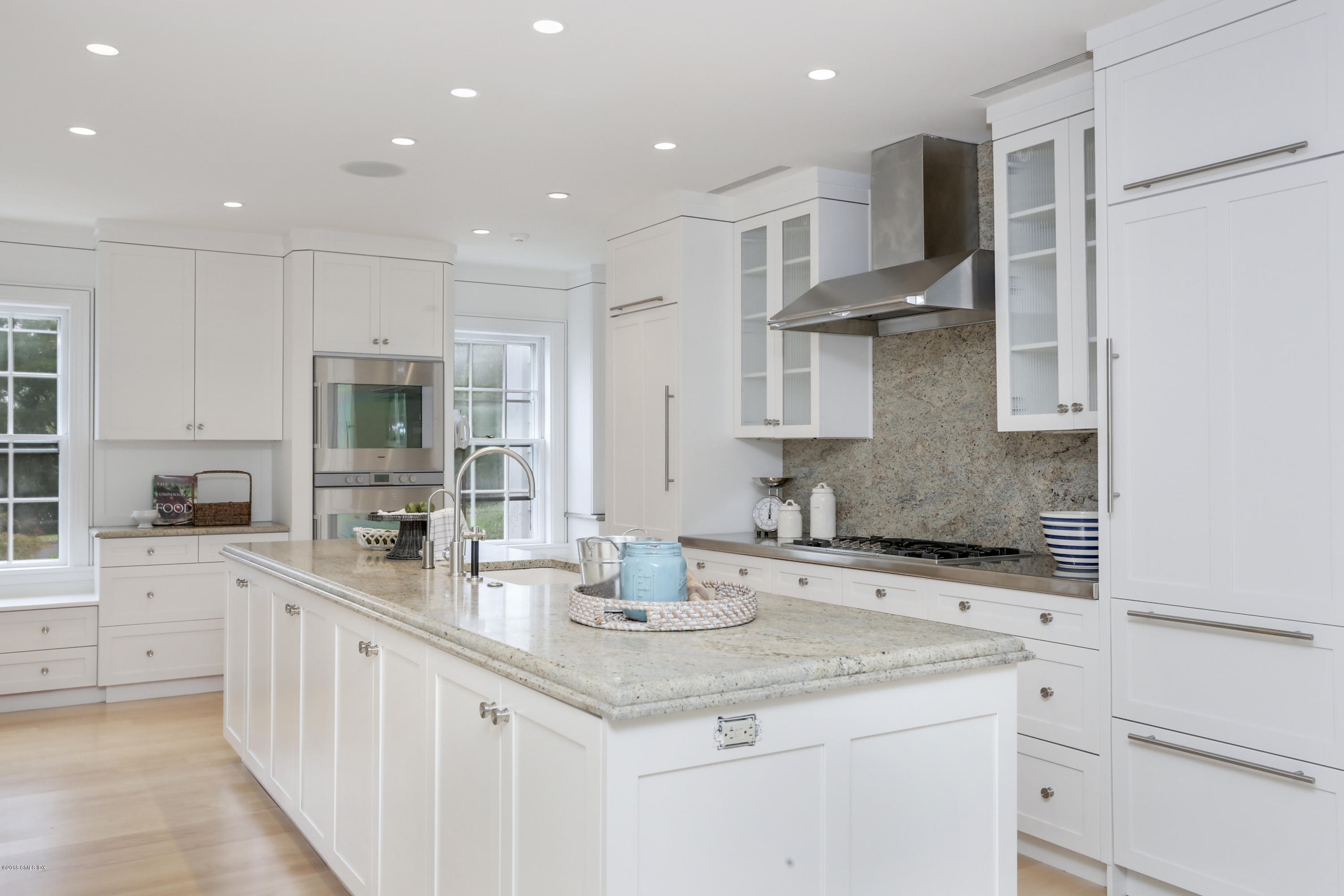 70 Midwood Road Greenwich, CT 06830 - Photo 10 of 26 a kitchen with stainless steel appliances granite countertop a sink and a refrigerator