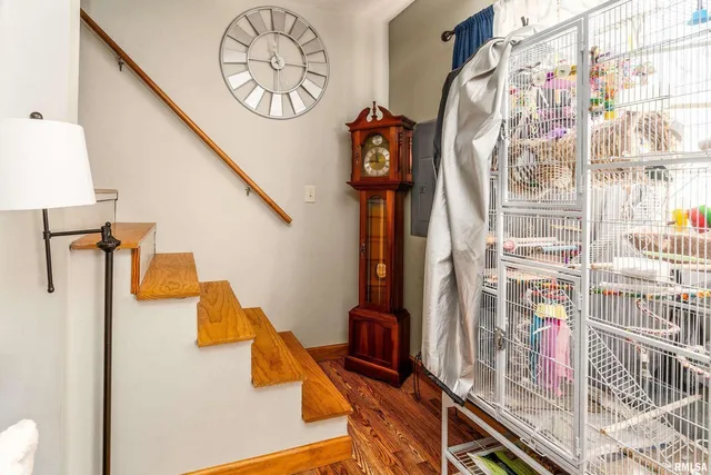 a room with wooden floor and furniture
