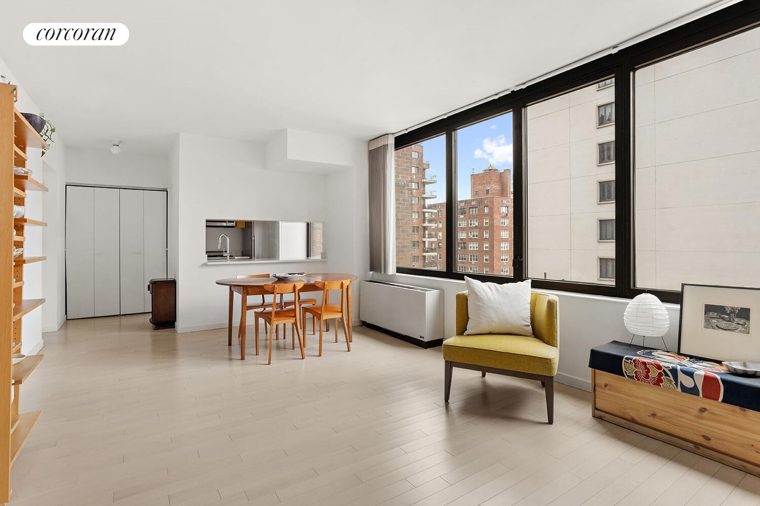 52 East End Avenue, Unit 8B Manhattan, NY 10028 - Photo 2 of 9 a living room with furniture and a flat screen tv