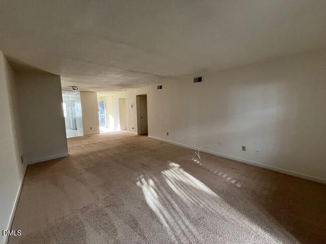 2516 Avent Ferry Road, Unit 102 Raleigh, NC 27606 - Photo 5 of 15 a view of an empty room and window