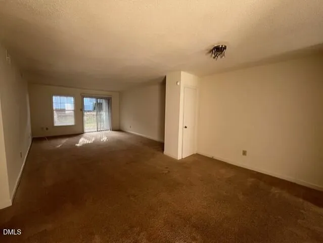 a view of empty room with windows