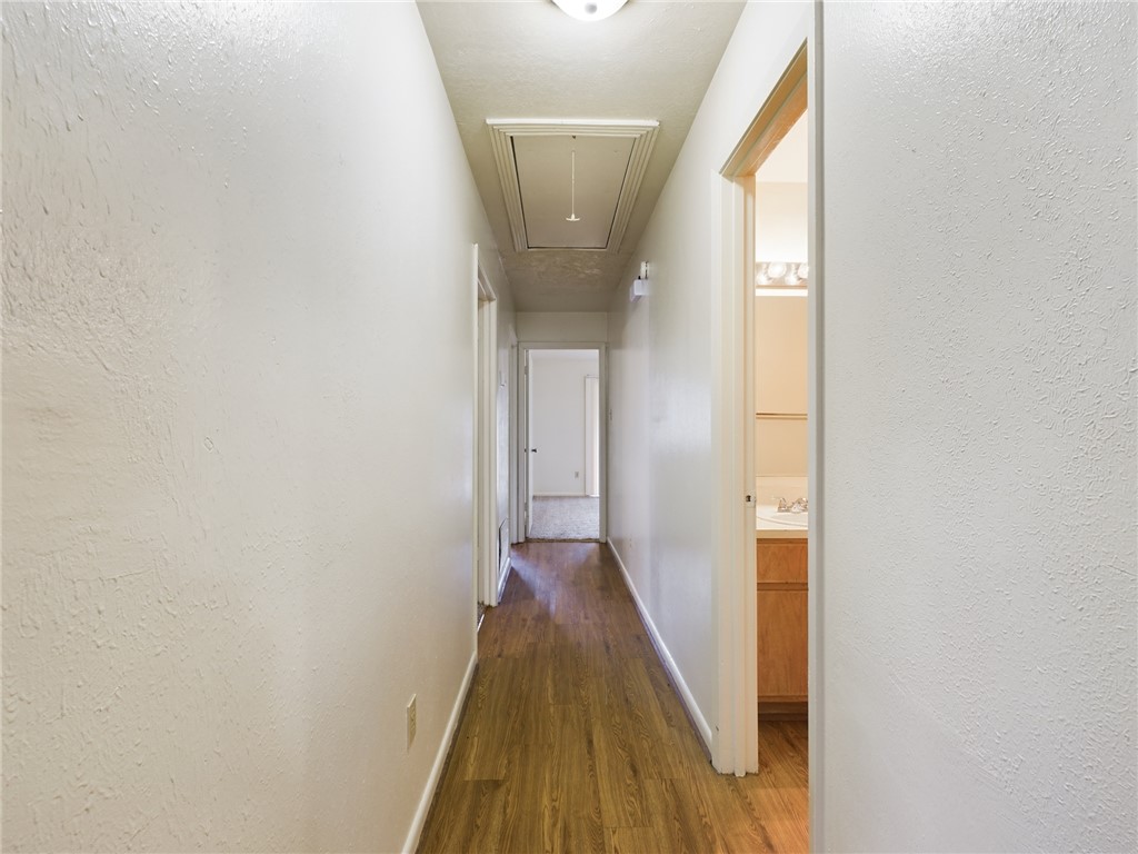 1221 April Bloom, Unit AB College Station, TX 77840 - Photo 15 of 31 a view of a hallway with wooden floor and a bathroom