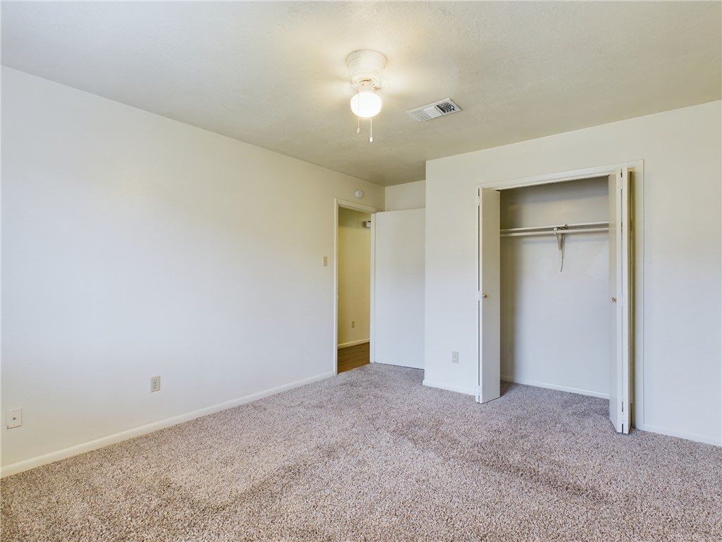 1221 April Bloom, Unit AB College Station, TX 77840 - Photo 21 of 31 a view of an empty room and a ceiling fan